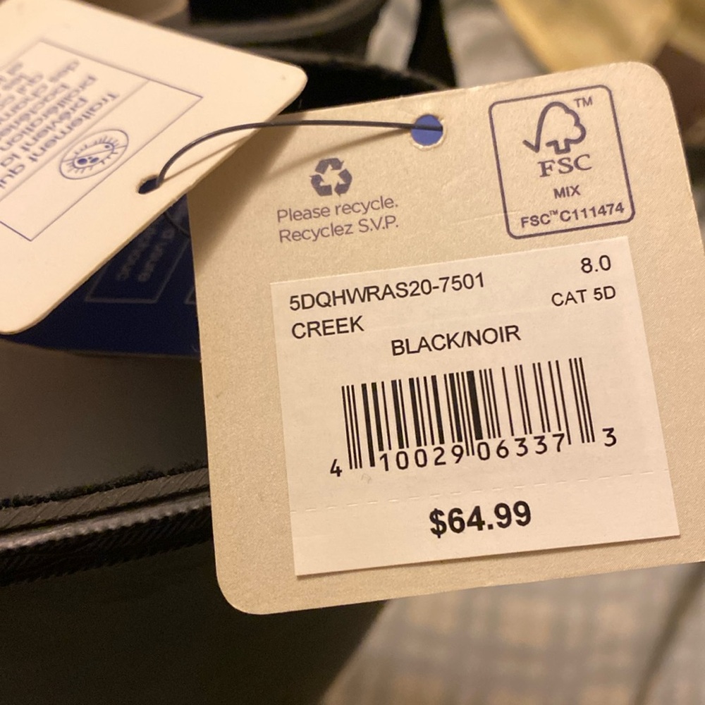 Rubber boots never been worn. Tags are still attached to them.